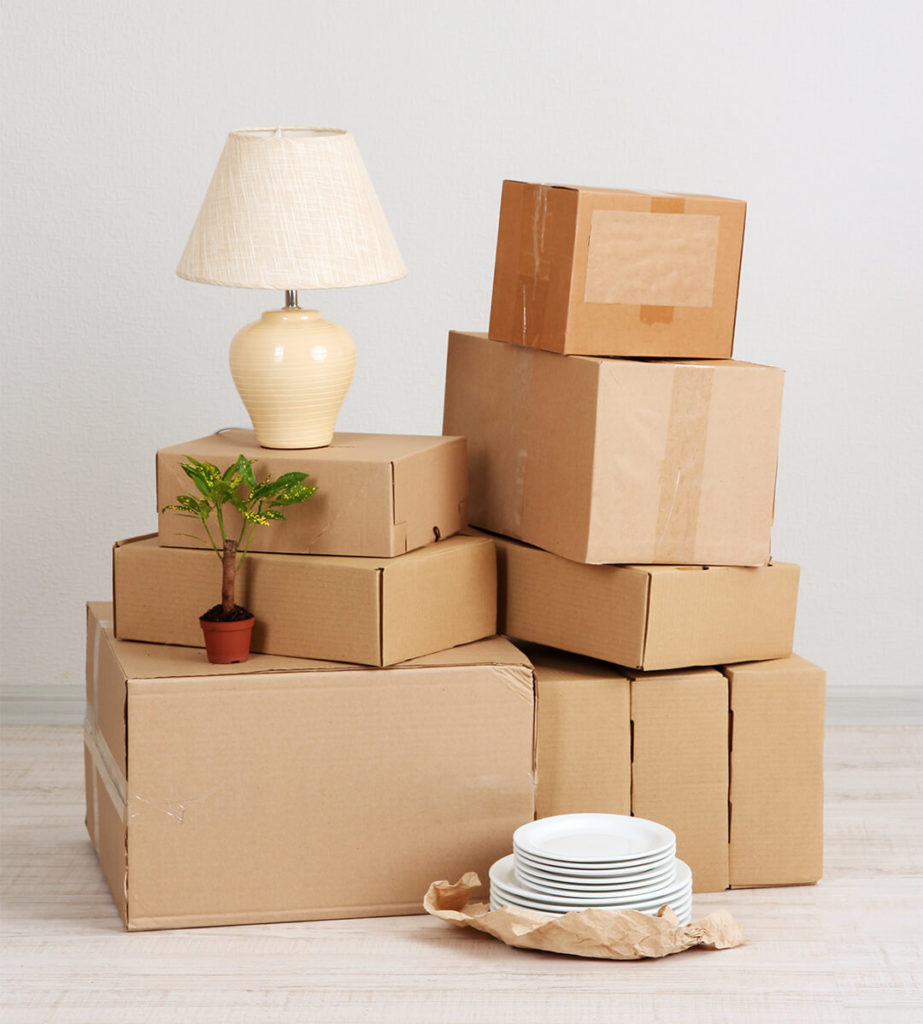 Cardboard boxes, a lamp and some plates