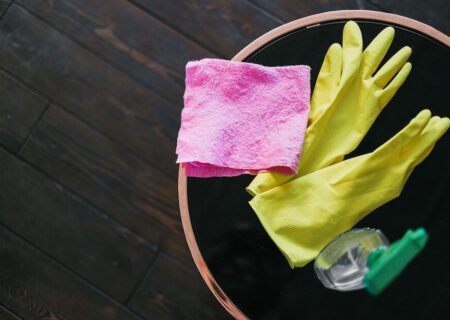 Rubber gloves, cloth and cleaner to help with spring cleaning a house