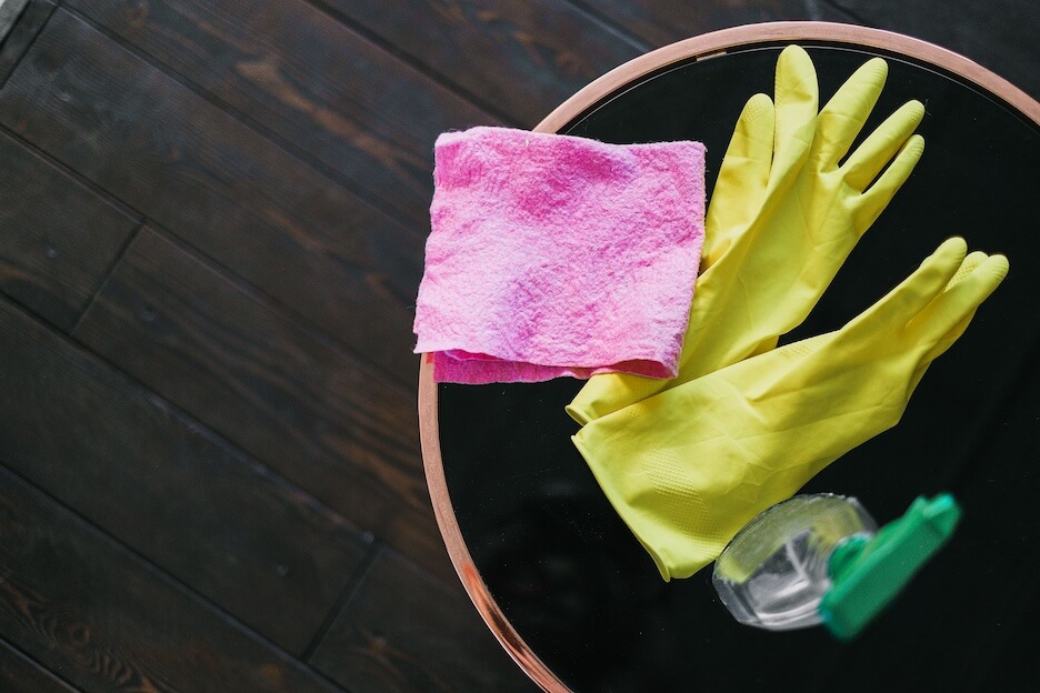 Rubber gloves, cloth and cleaner to help with spring cleaning a house